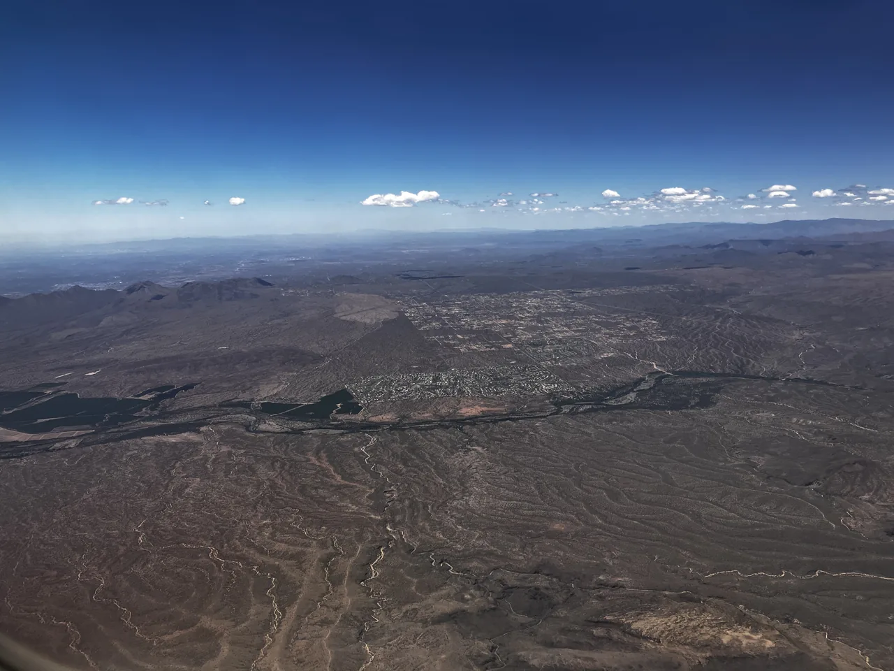 Aerial view of North Scottsdale neighborhoods surrounded by desert terrain.